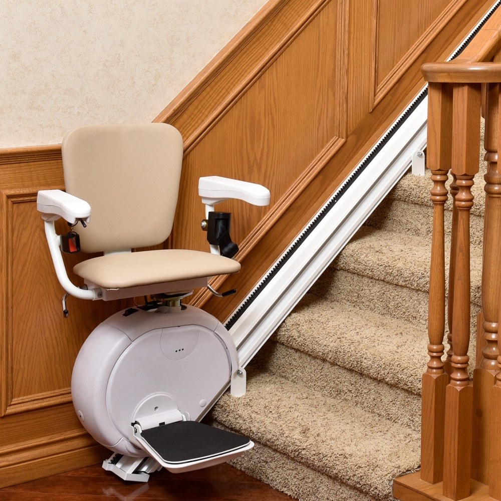 Stairlift chair installed on carpeted stairs